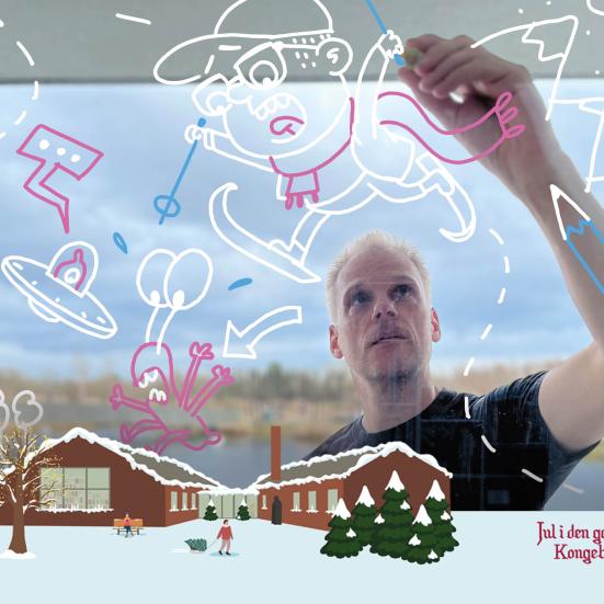 Peter Hermann står og tegner sjove illustrationer.